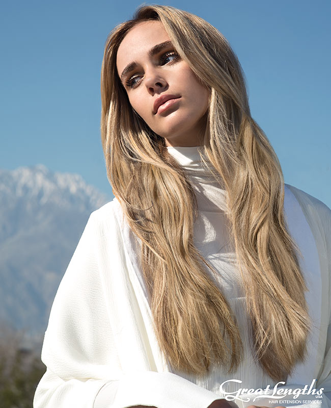 hair extension model with long blond hair